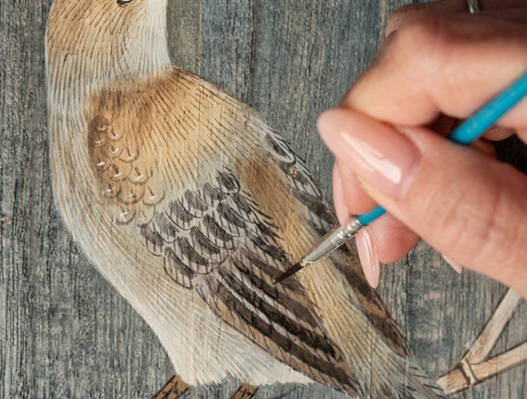 Artist finishing a wallcovering design